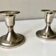 Pair of silver metal candle holders