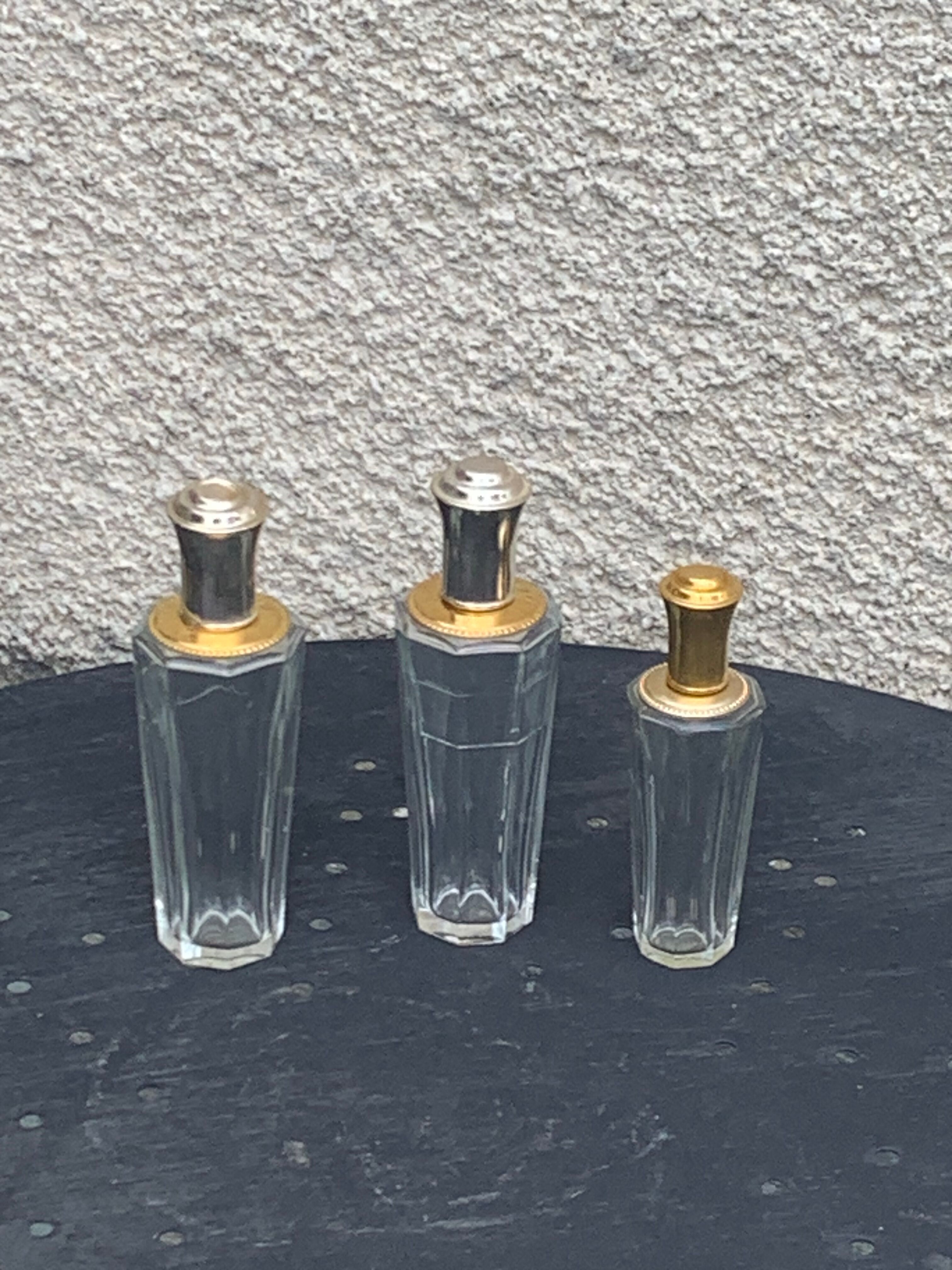 Three bottles of crystal perfume signed Marcel Rochas old france
