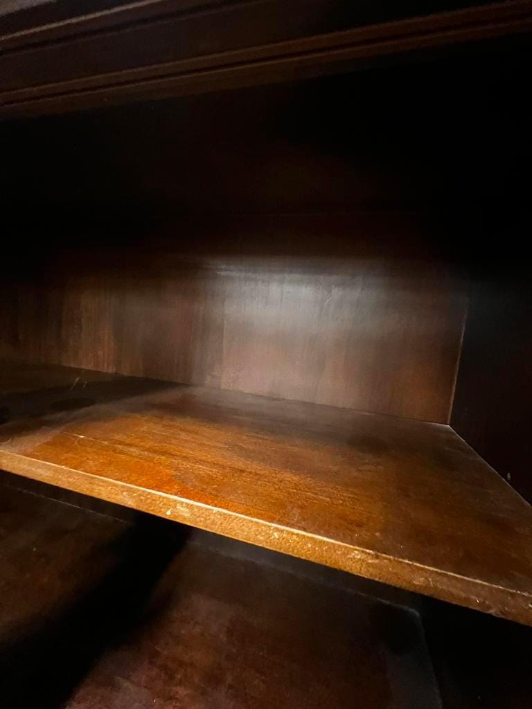 Vintage wooden display cabinet with sliding doors.