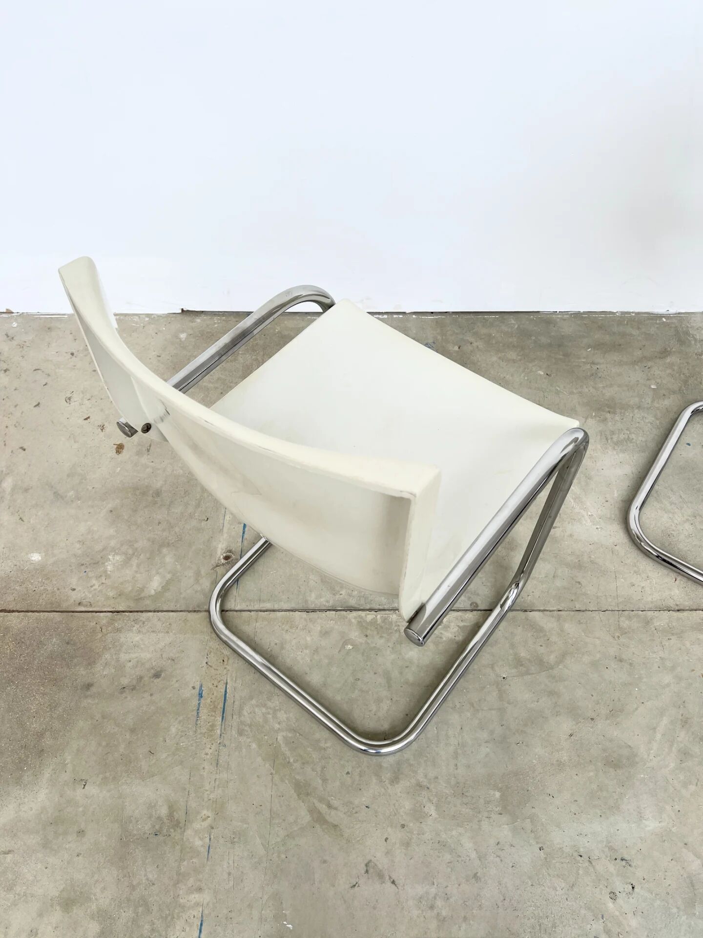 Pair of white moulded shell chairs with chrome tube — Space Age 70s
