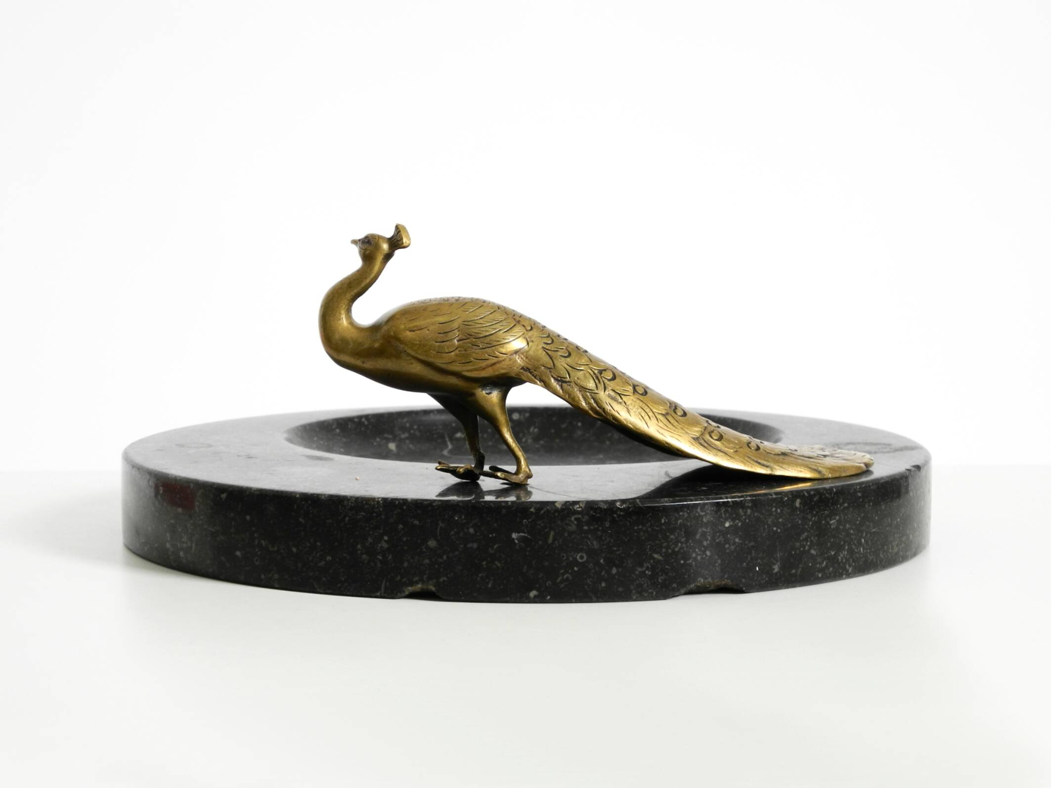 Beautiful, large black granite valet tray featuring a brass peacock, circa