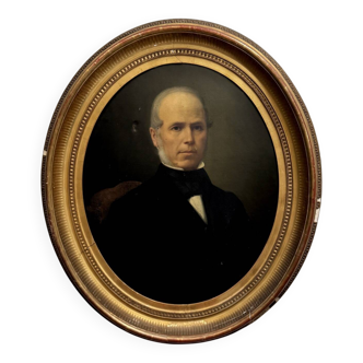 Oil on canvas portrait of a man, late 19th century, oval frame gilded with gold leaf.