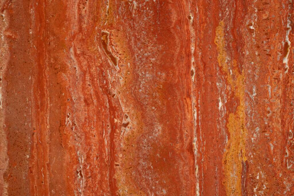 Willy Rizzo. Large table in orange-red travertine. 1970s.