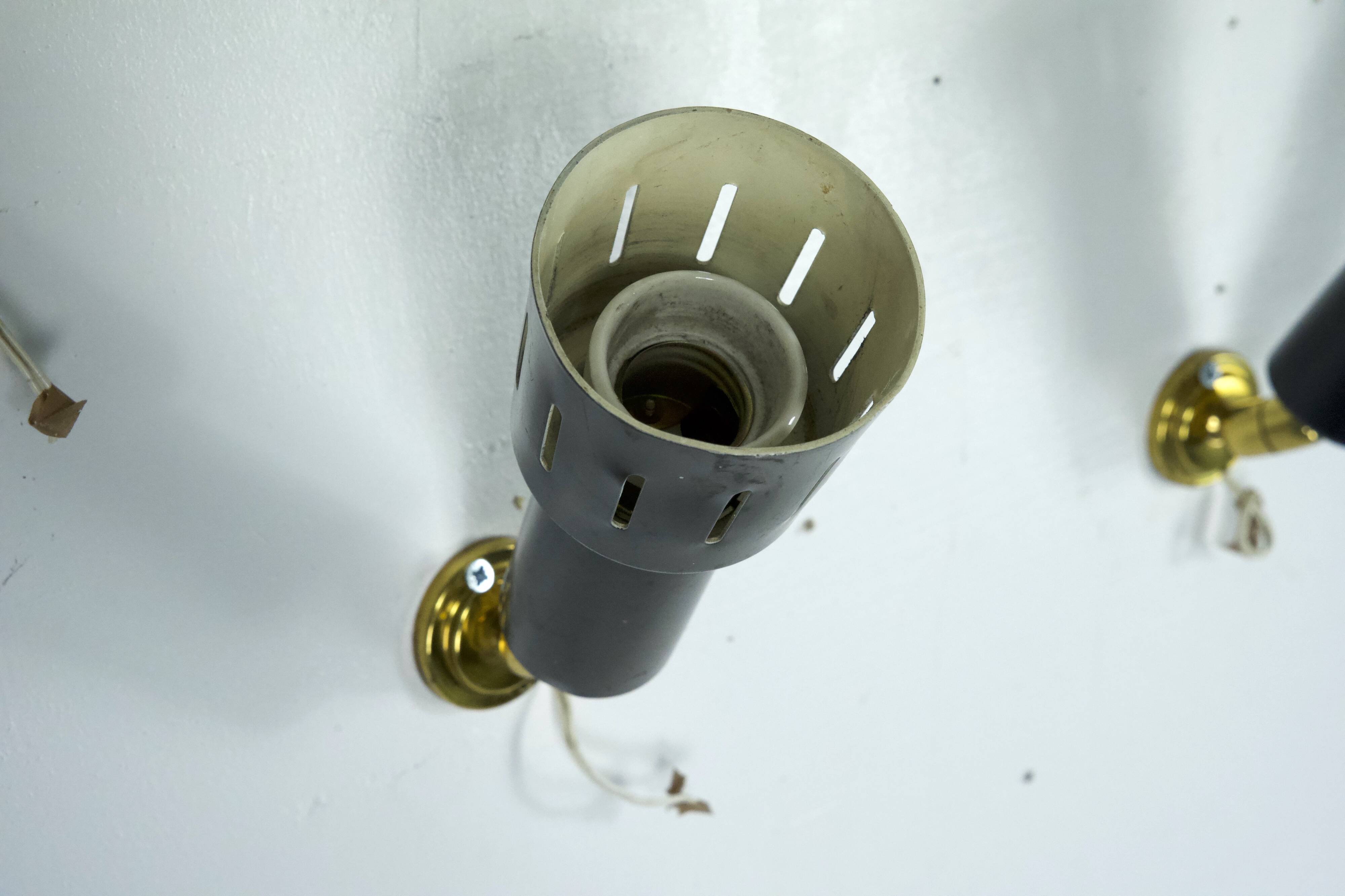 Set of five Stilnovo style spotlights in brass and lacquered metal. Italy