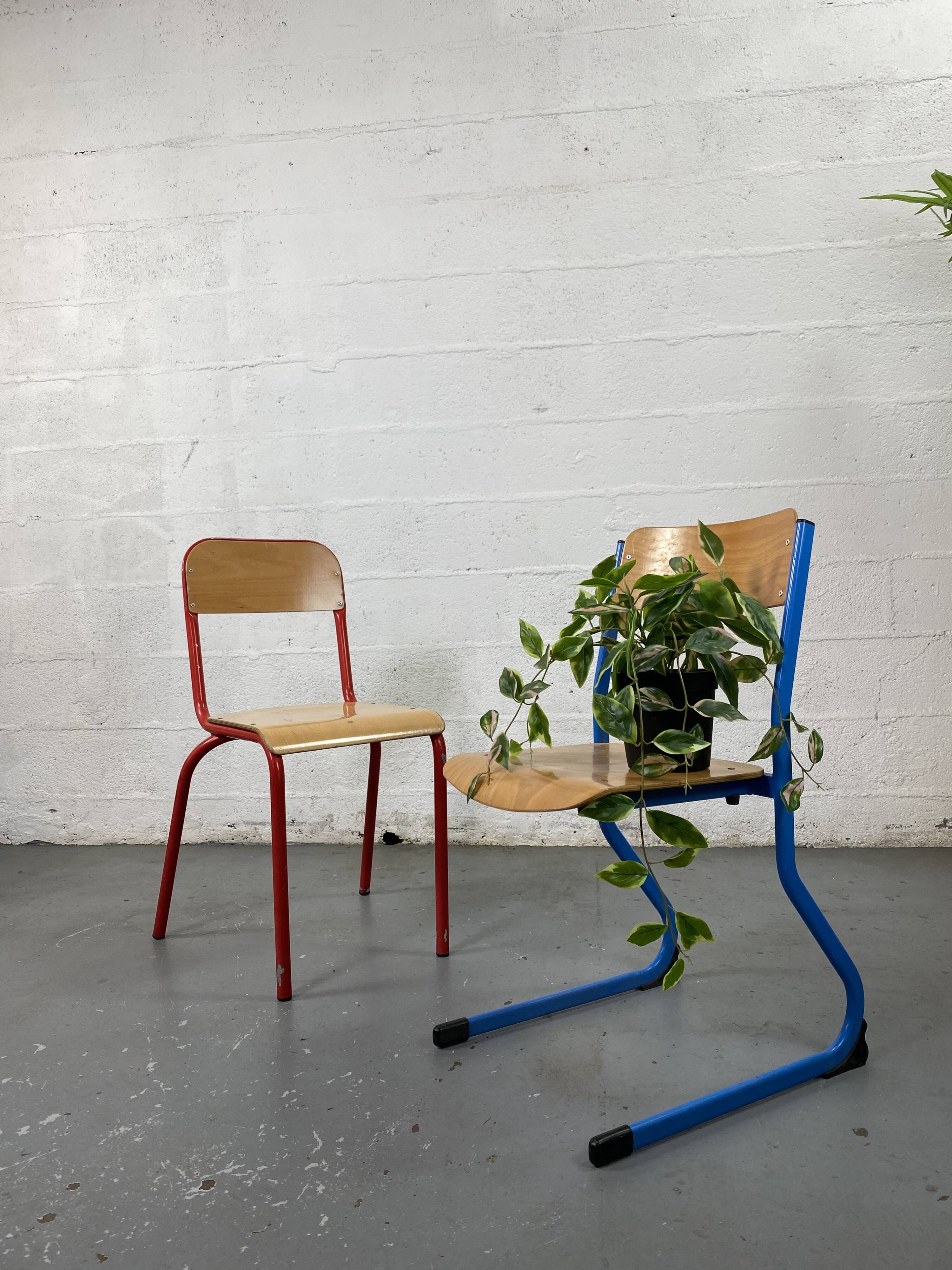 Set of 2 mismatched industrial school chairs