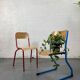 Set of 2 mismatched industrial school chairs