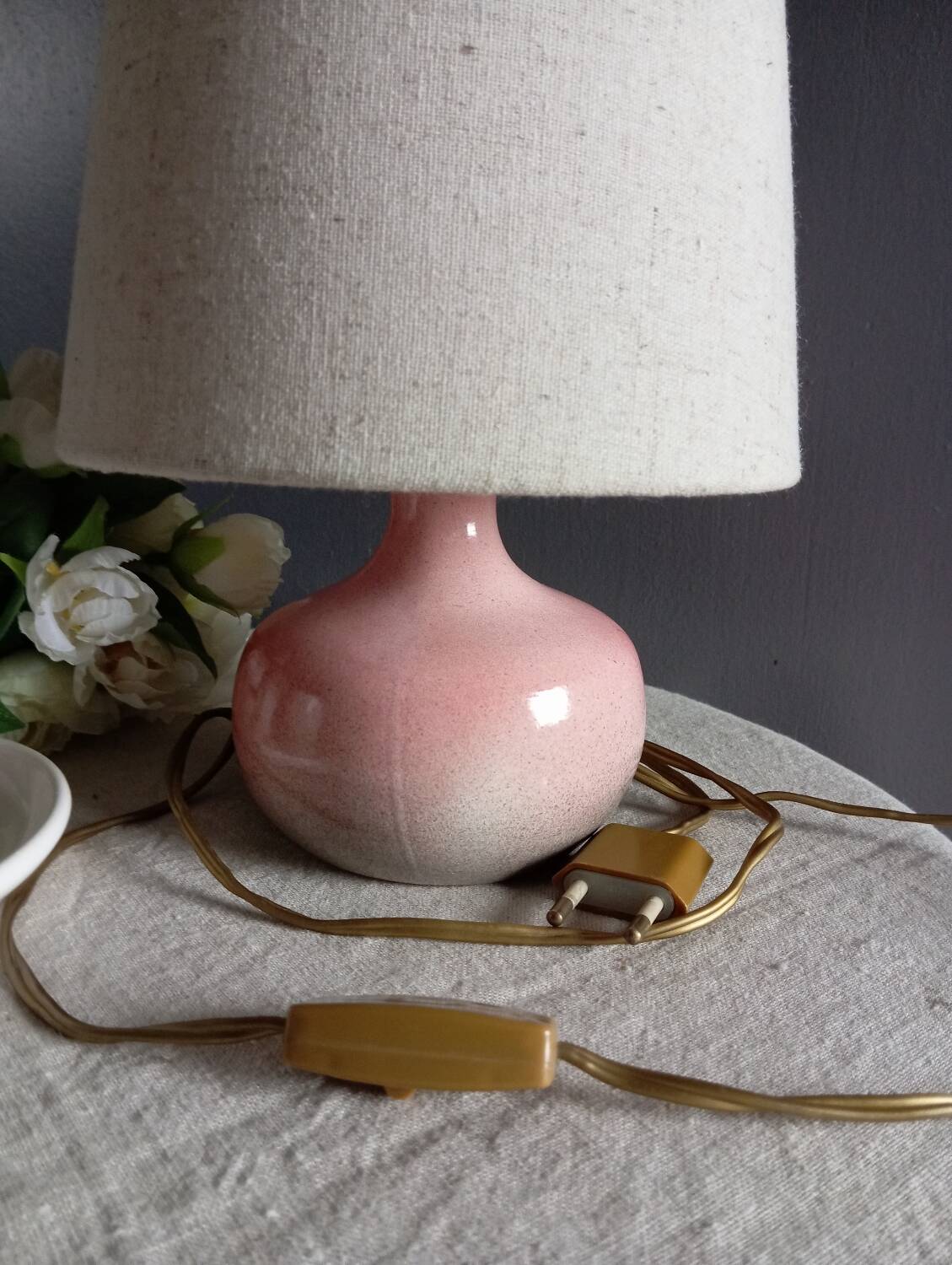 Signed speckled pink ceramic bedside lamp, linen lampshade