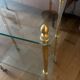 Elegant wheeled serving trolley in gilded brass and glass, in a spirit