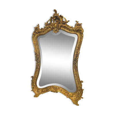 Miroir rocaille de style Louis XV en bois et stuc doré XX siècle