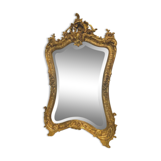 Miroir rocaille de style Louis XV en bois et stuc doré XX siècle