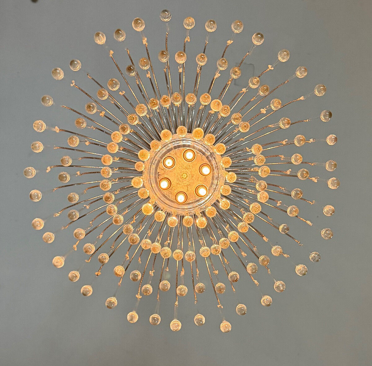 Pair of large chandeliers adorned with glass drops, chrome metal structures, Italy circa 1960.