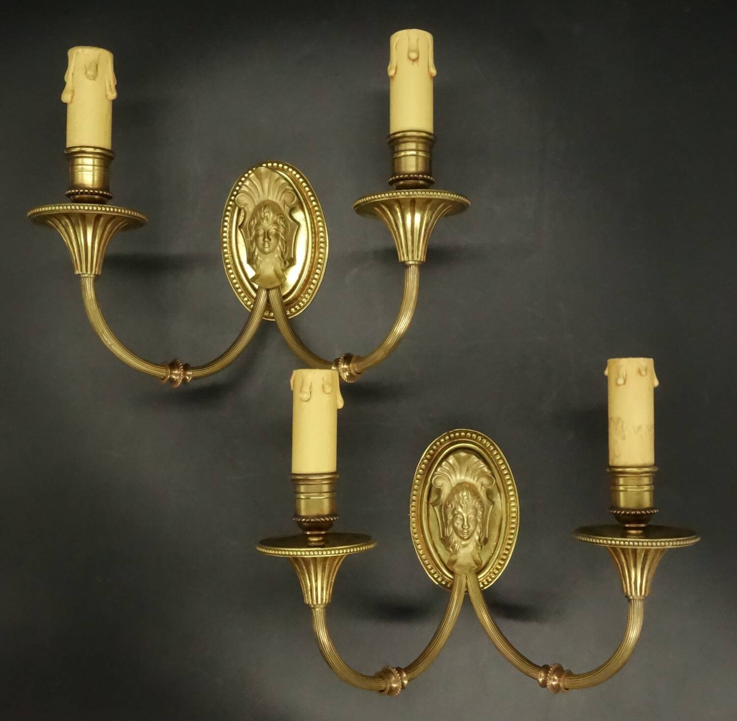 Pair of wall sconces with female masks in Louis XVI style - gilded bronze
