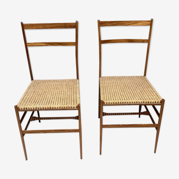 Set of 2 wooden and rattan chairs.