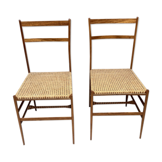 Set of 2 wooden and rattan chairs.
