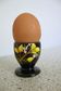 Black egg cup with hand-painted floral decoration