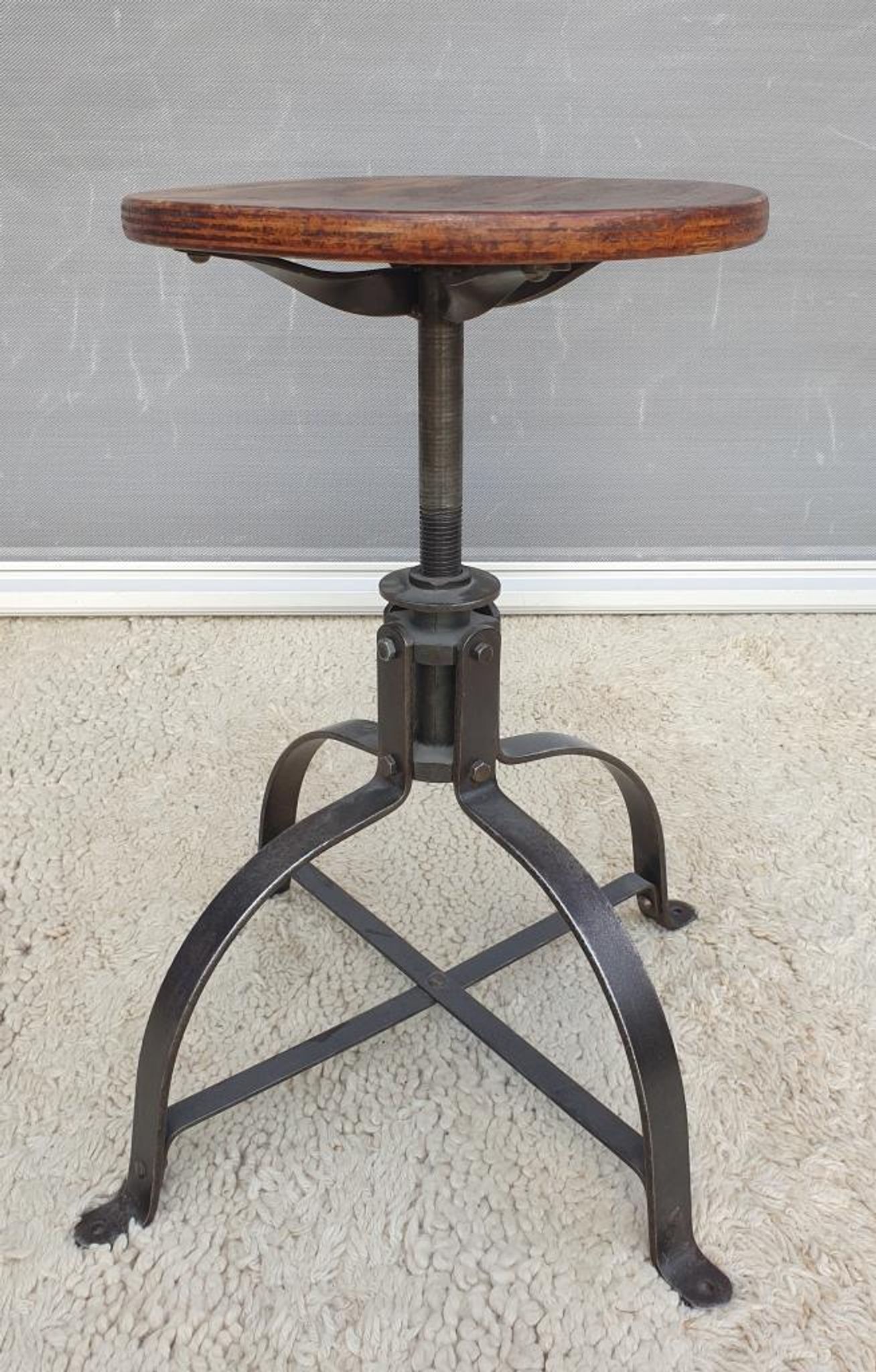 Bienaise stool of the years 1935, model 203 with 4 flat iron cathedral legs joined by a