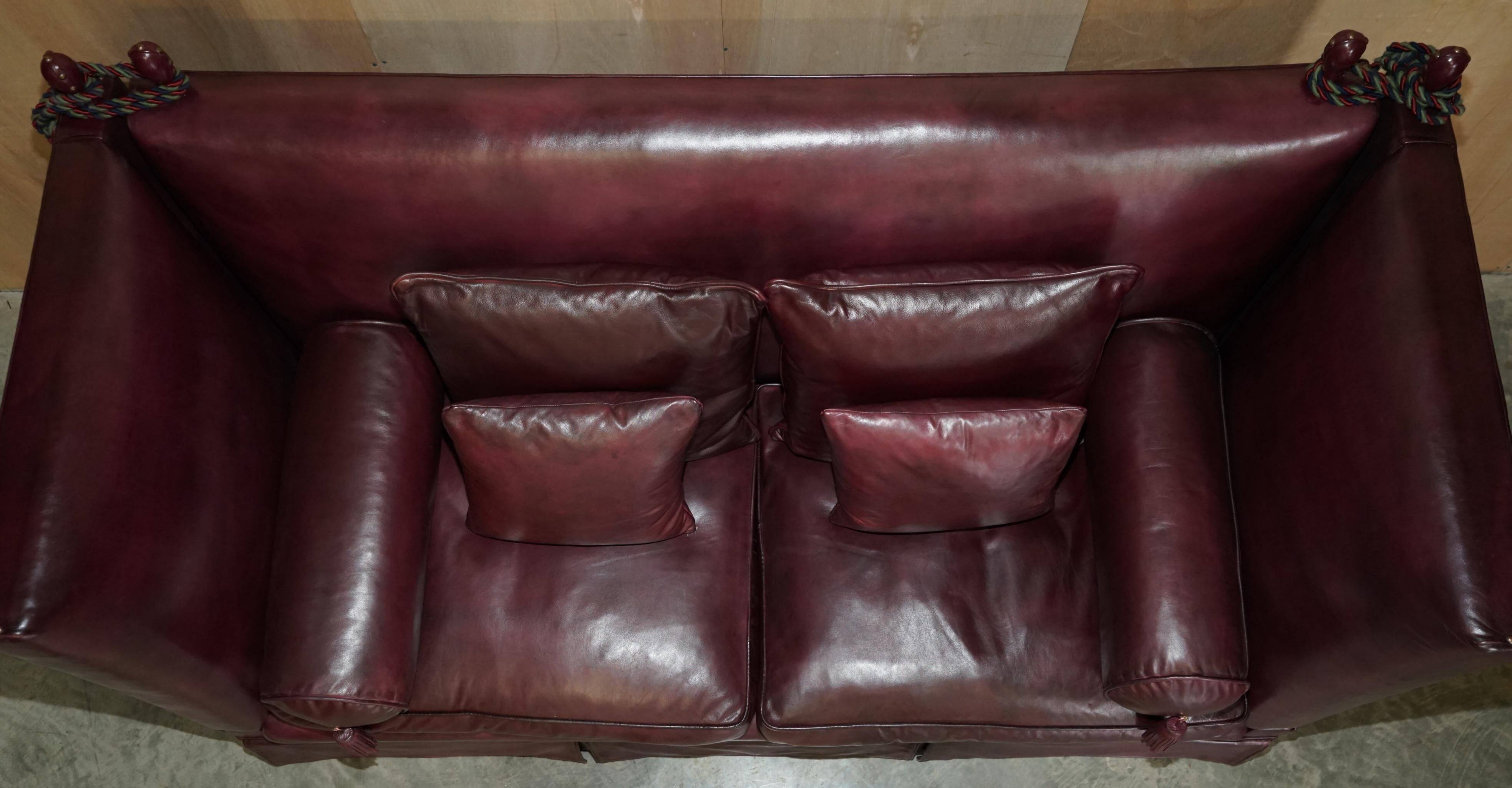 Victorian Knole canapé restored in leather with feather cushions.