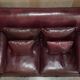Victorian Knole canapé restored in leather with feather cushions.