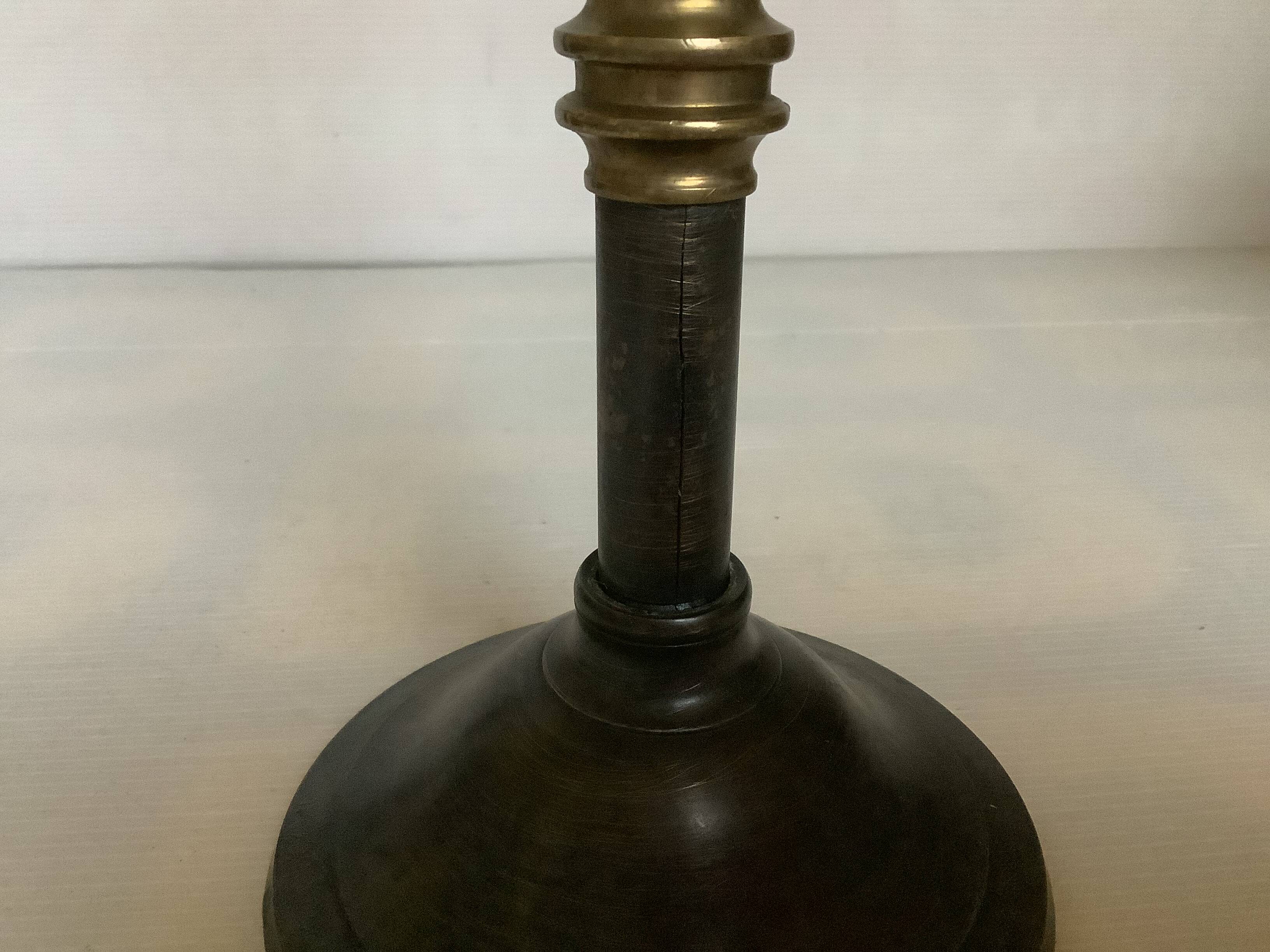 Large candlestick made of sheet metal and brass
