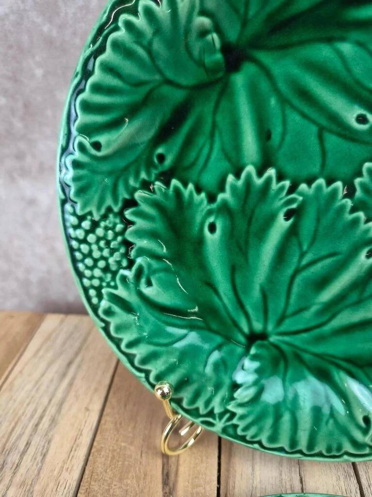 Set of 2 green earthenware dessert plates with vine decoration.