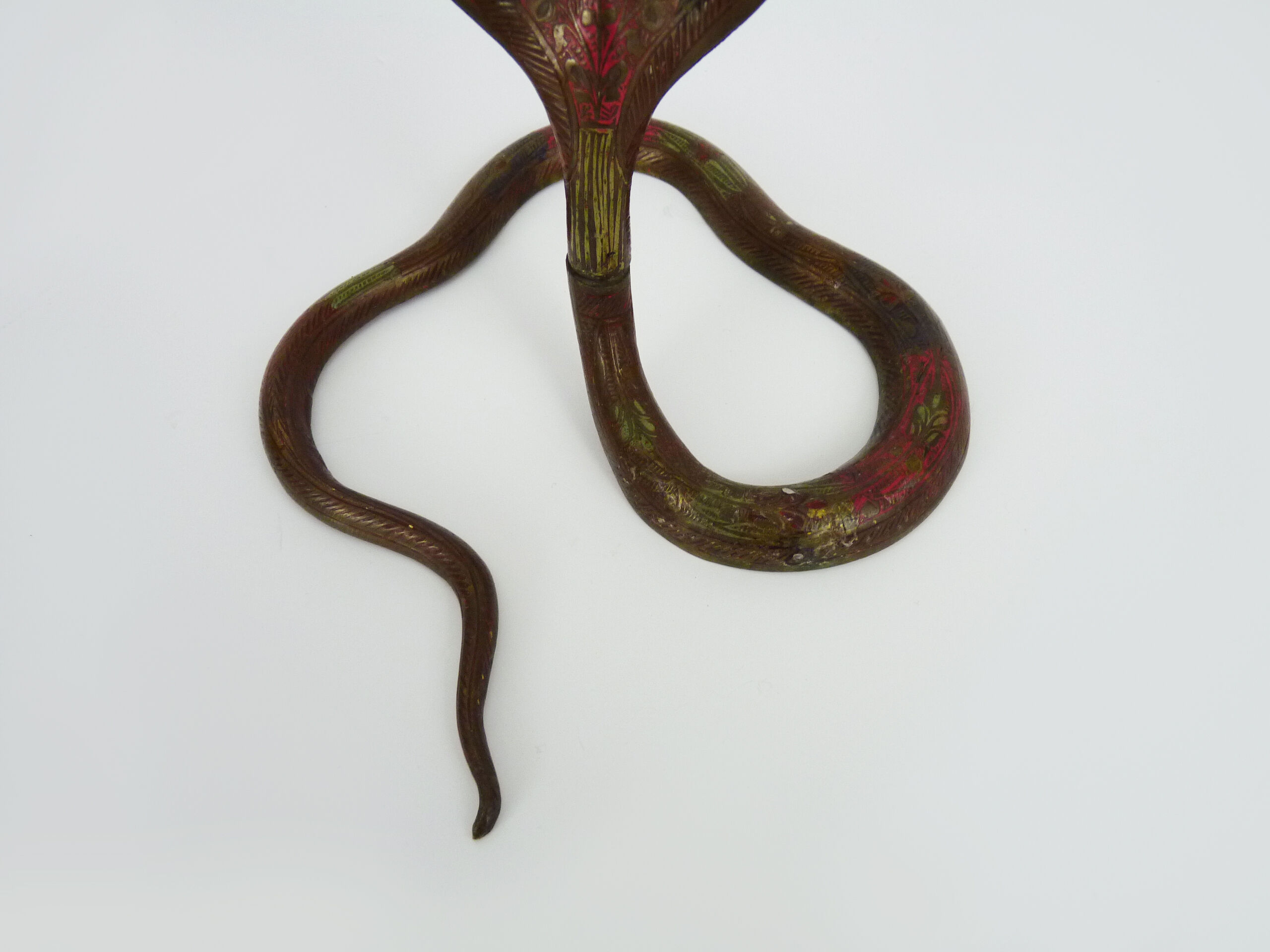 Pair of old bronze cobra candle holders with detailed engraving. Around 1950