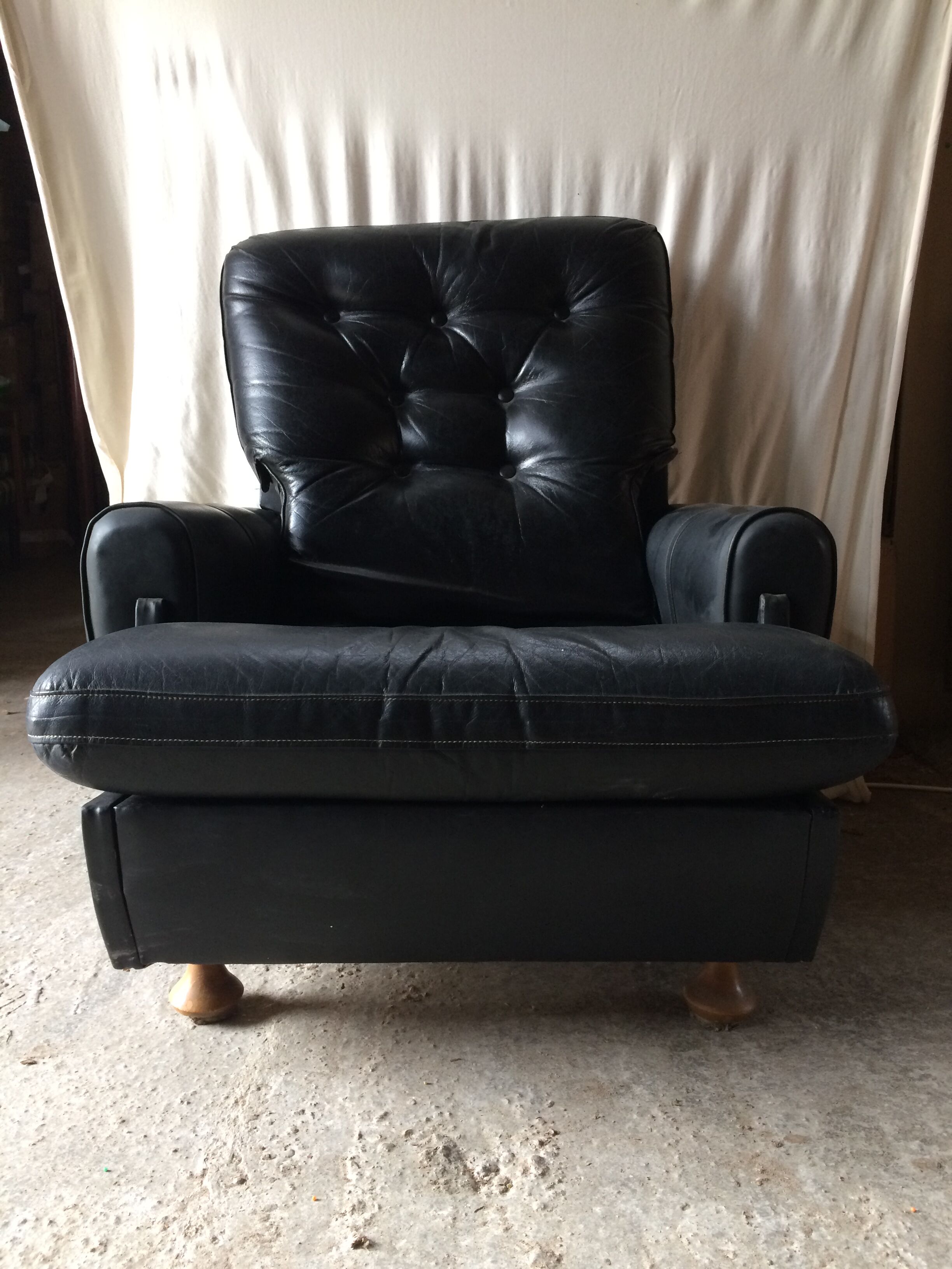 Former black leather chair