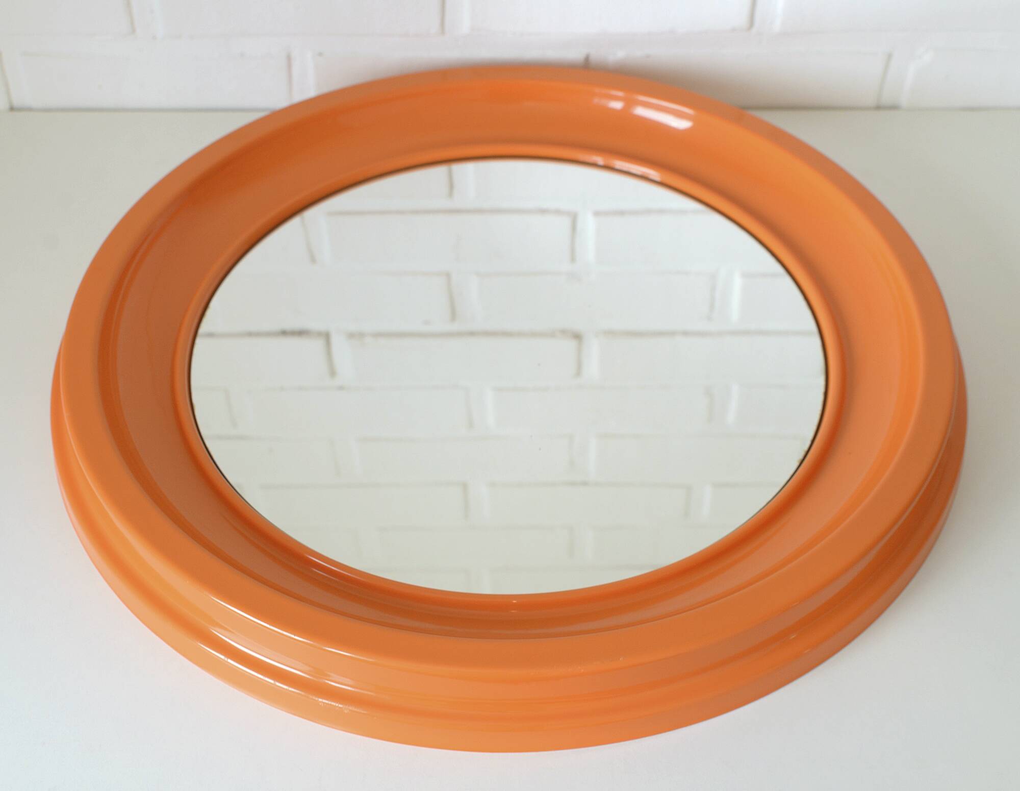 Orange vintage round wall plastic mirror 1980s, space age vanity mirror