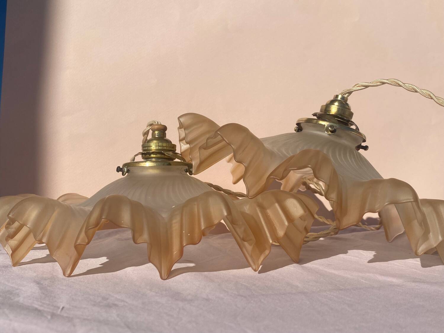 Pair of amber pendant lights