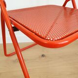 Perforated metal folding chair