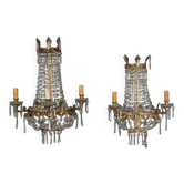 Antique wall sconces in gilded bronze with neoclassical motifs, 20th century.