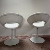 Pair of vintage white swivel armchairs in tulip style.