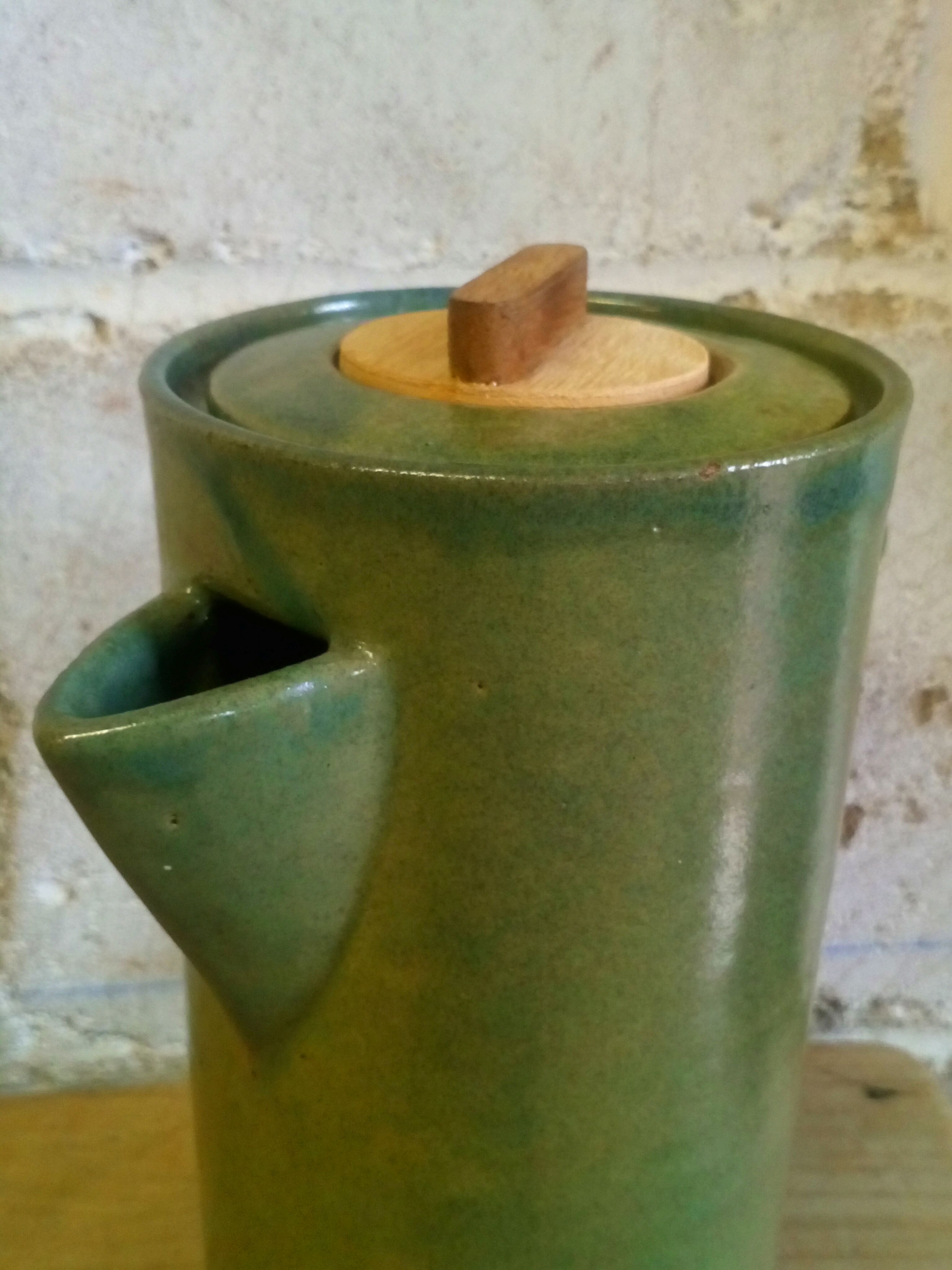 Green emailed sandstone teapot