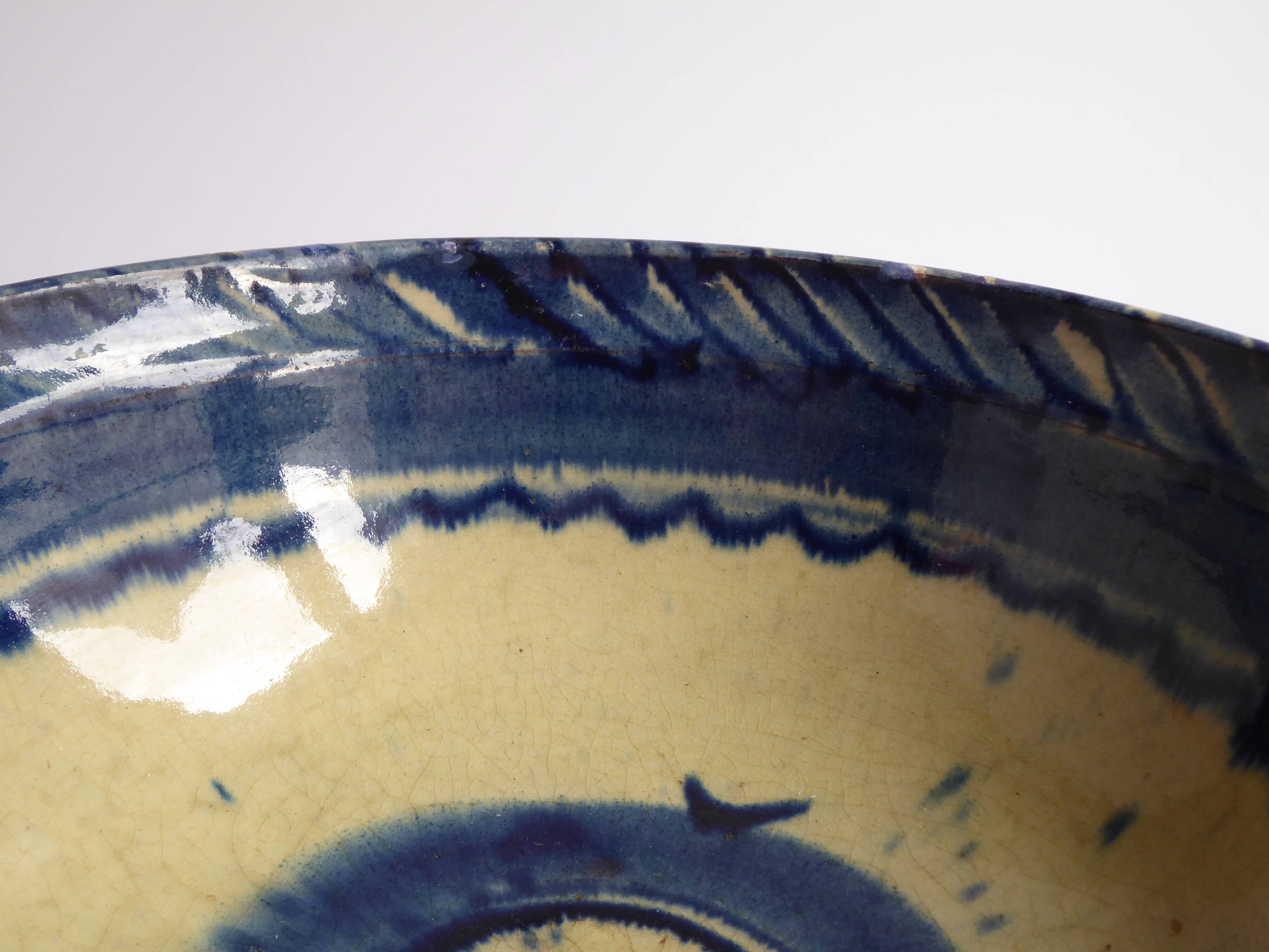 Blue enamelled terracotta cup