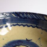 Blue enamelled terracotta cup