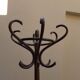 Curved wooden parrot coat holder