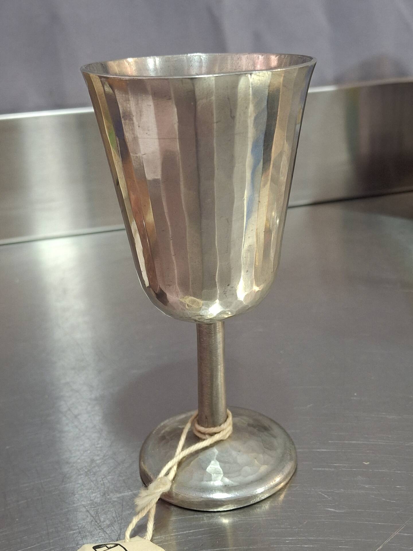 Footed glass in pewter