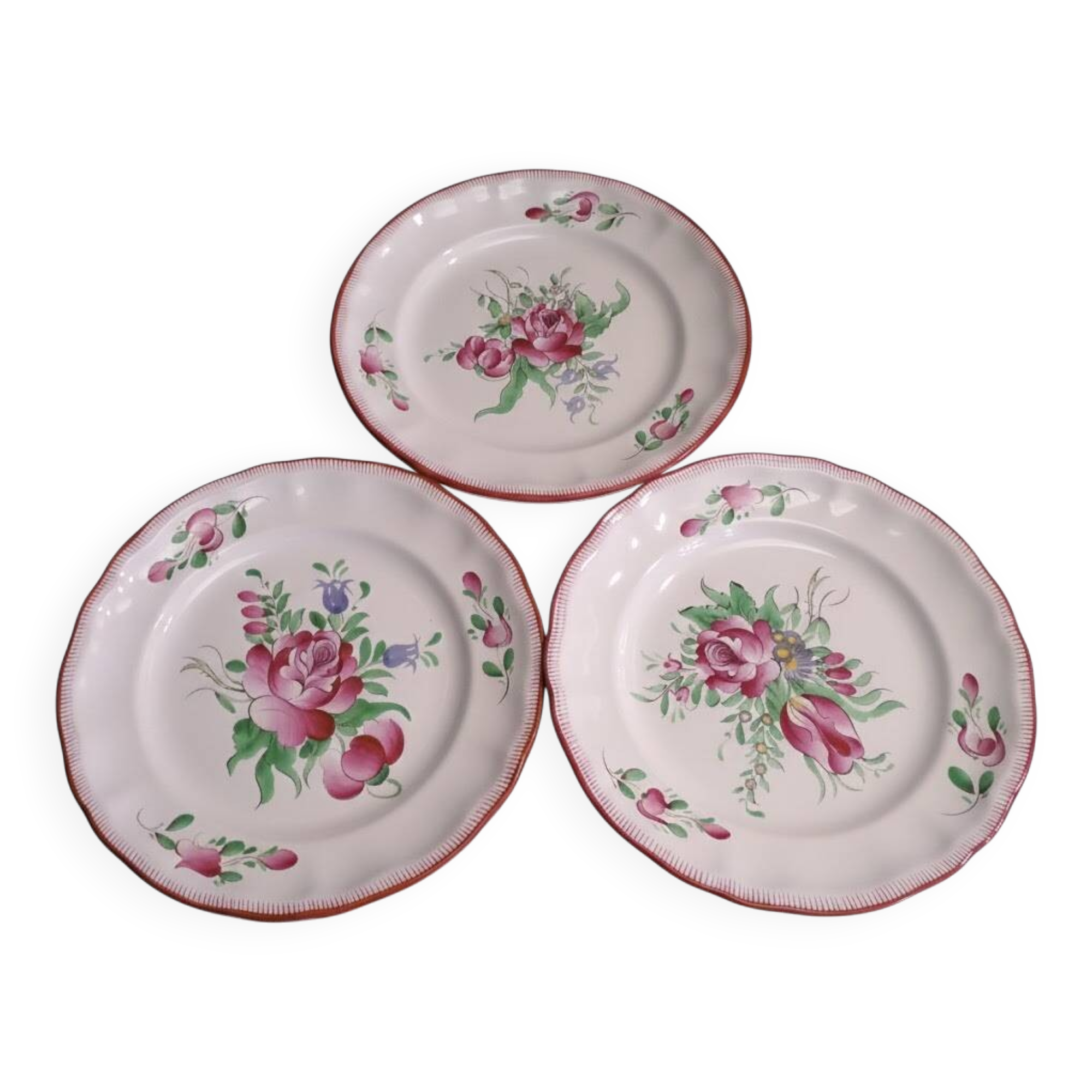 Three small hand-painted Saint-Clément dinner plates.