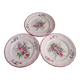 Three small hand-painted Saint-Clément dinner plates.