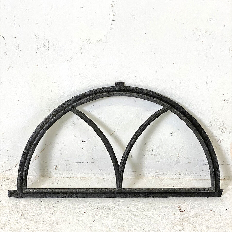 Old arched anthracite grey window