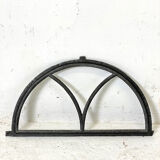 Old arched anthracite grey window