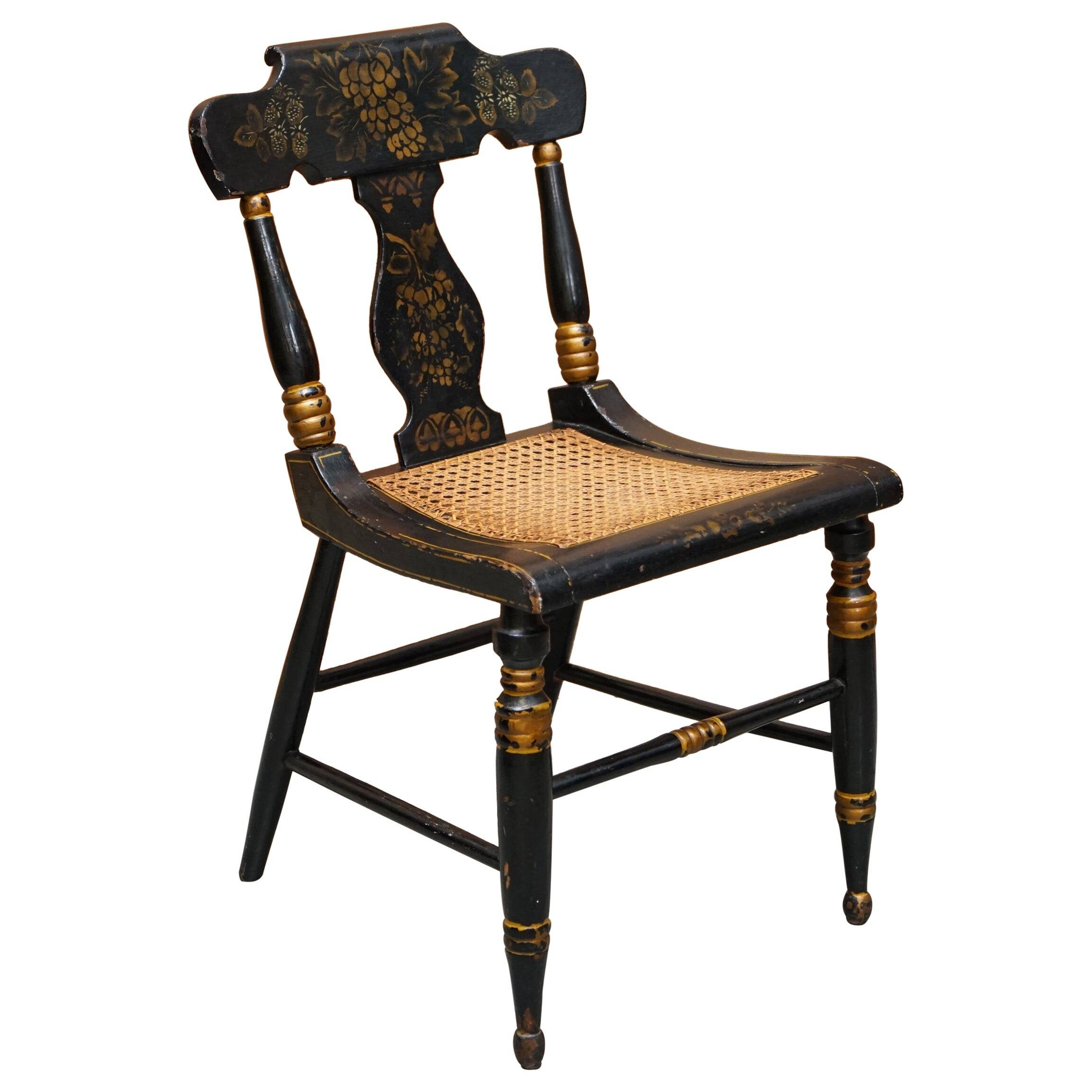 Georgian side bergère circa 1825, ebonised and hand-painted in Baltimore style.