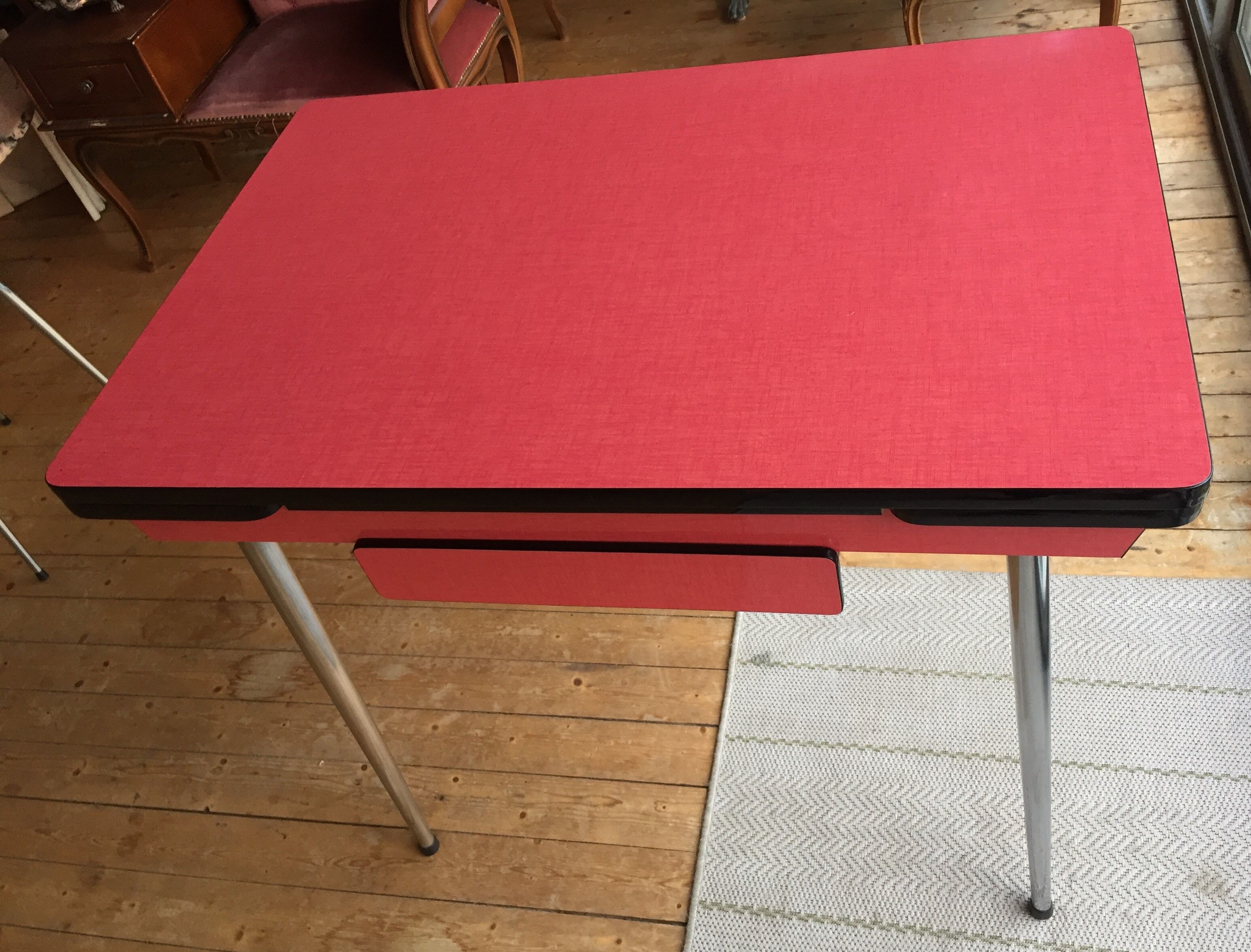 Table set and 2 vintage vintage pale red formica chairs