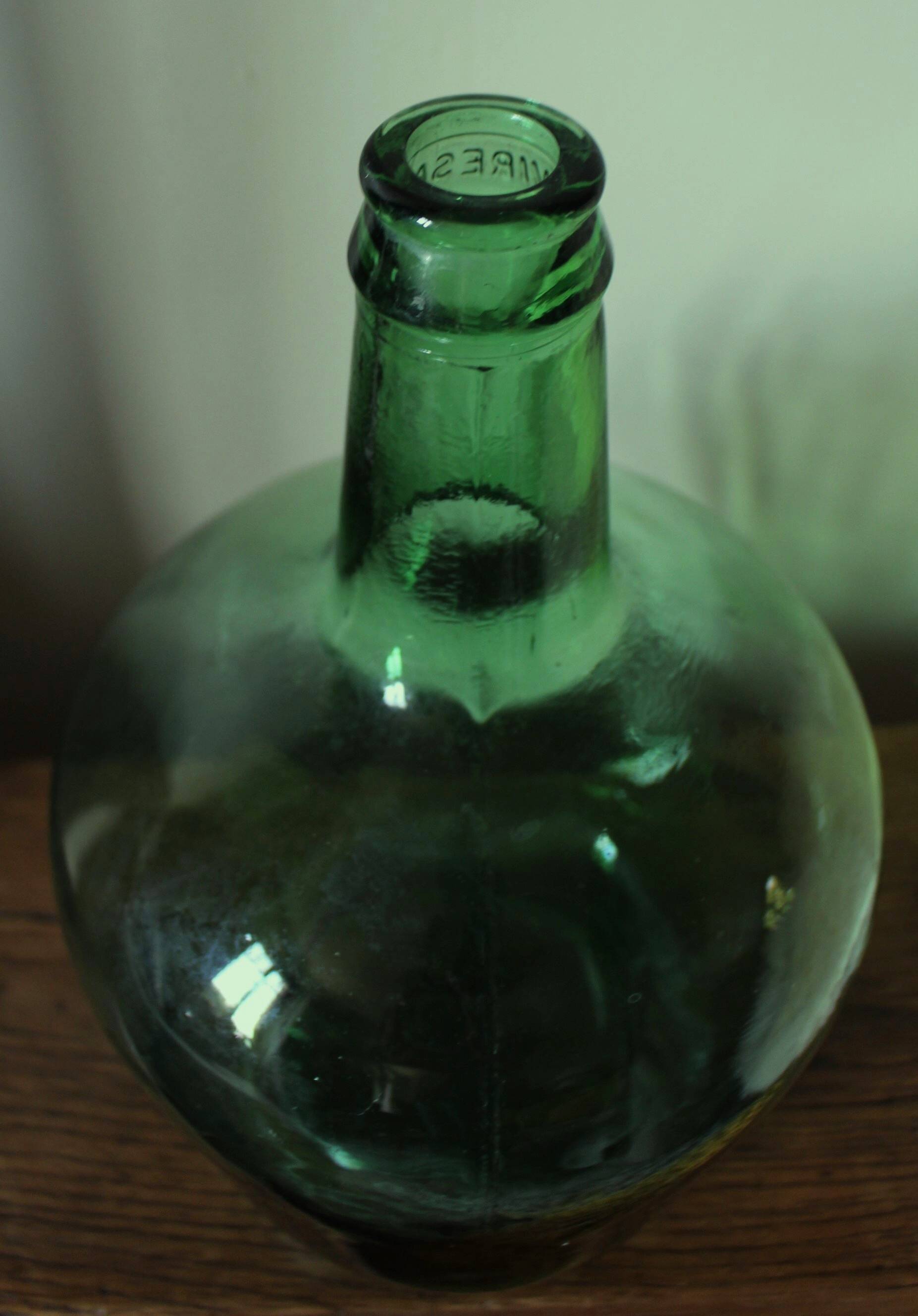 Give me a dark green glass Bonbonne jar.