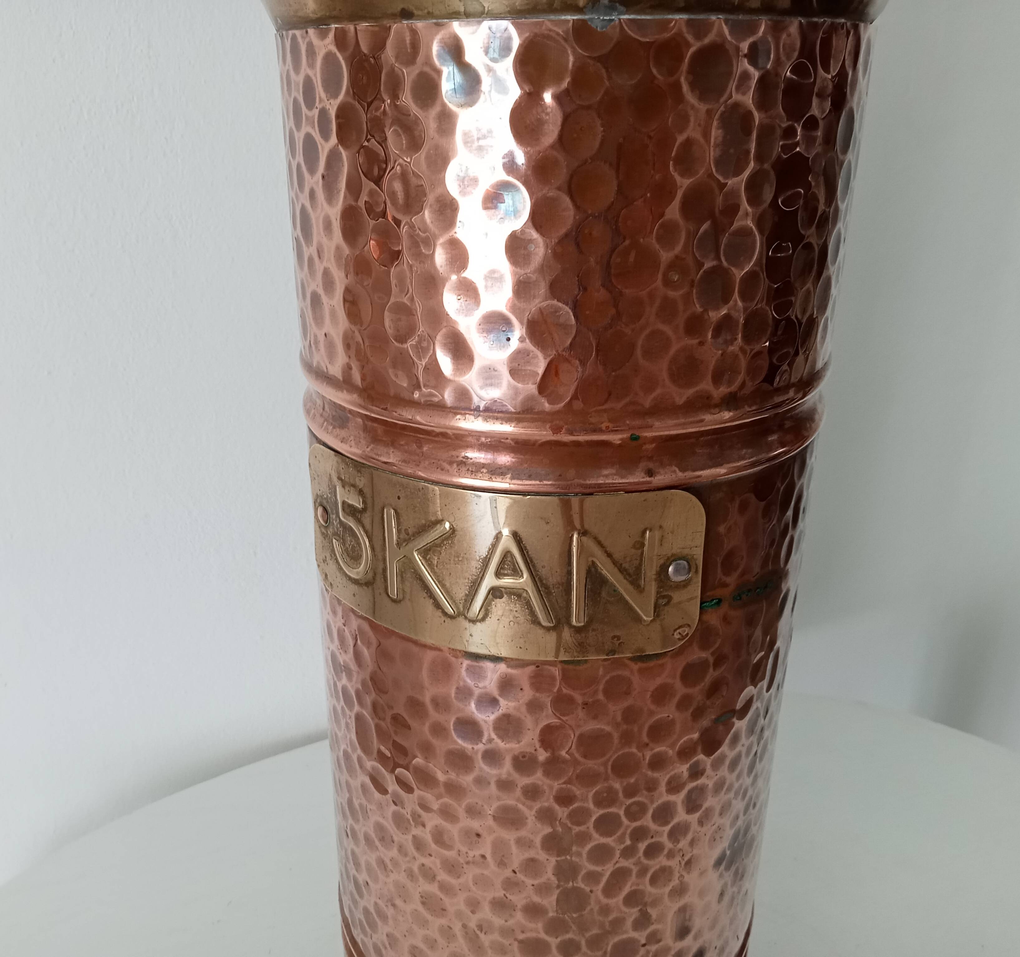 Old umbrella stand in copper, brass and porcelain