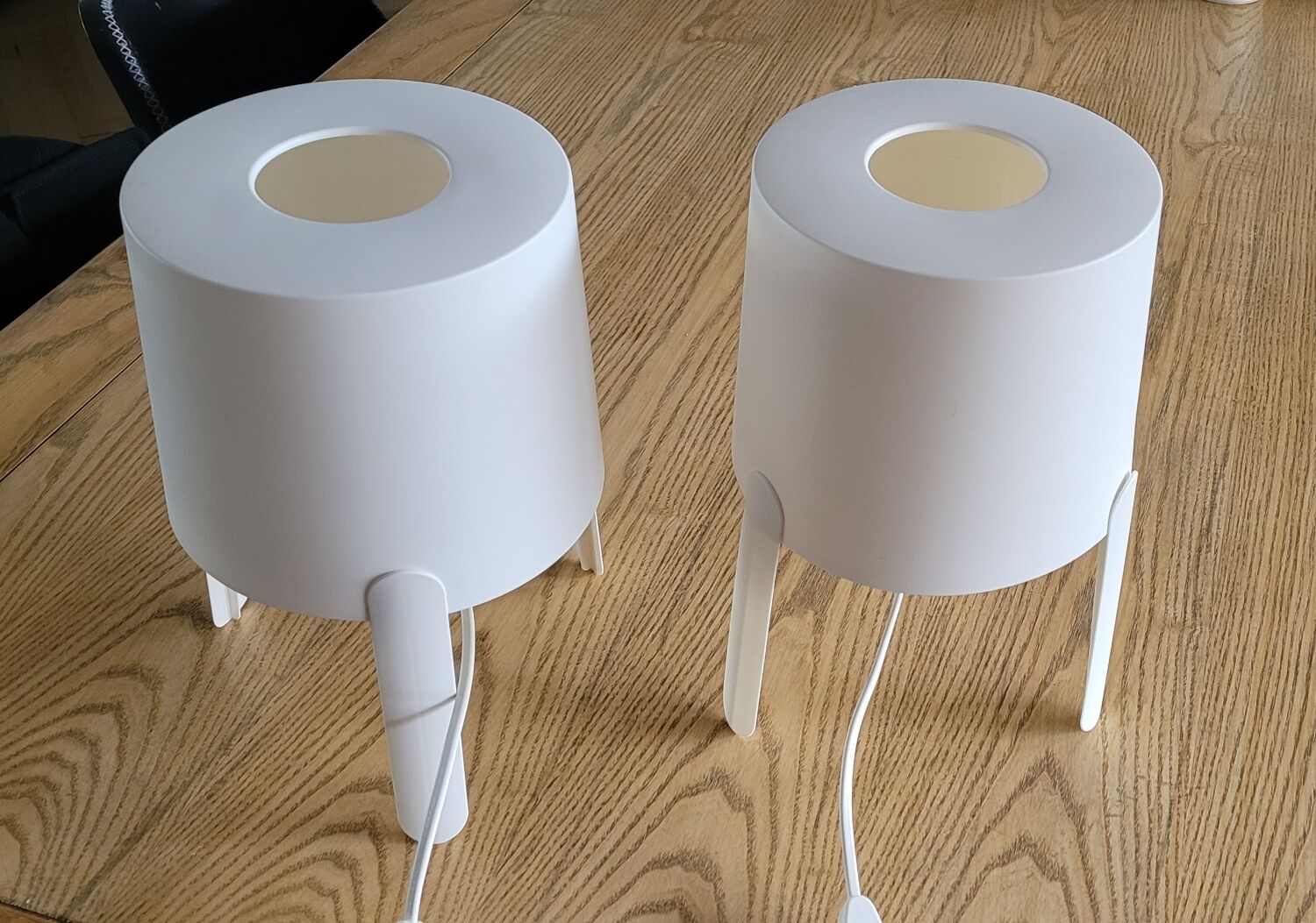 Pair of white Ikea Tvärs bedside lamps