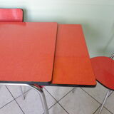 Table in red formica, 4 roc chairs, 2 extension cords, 2 drawers 60