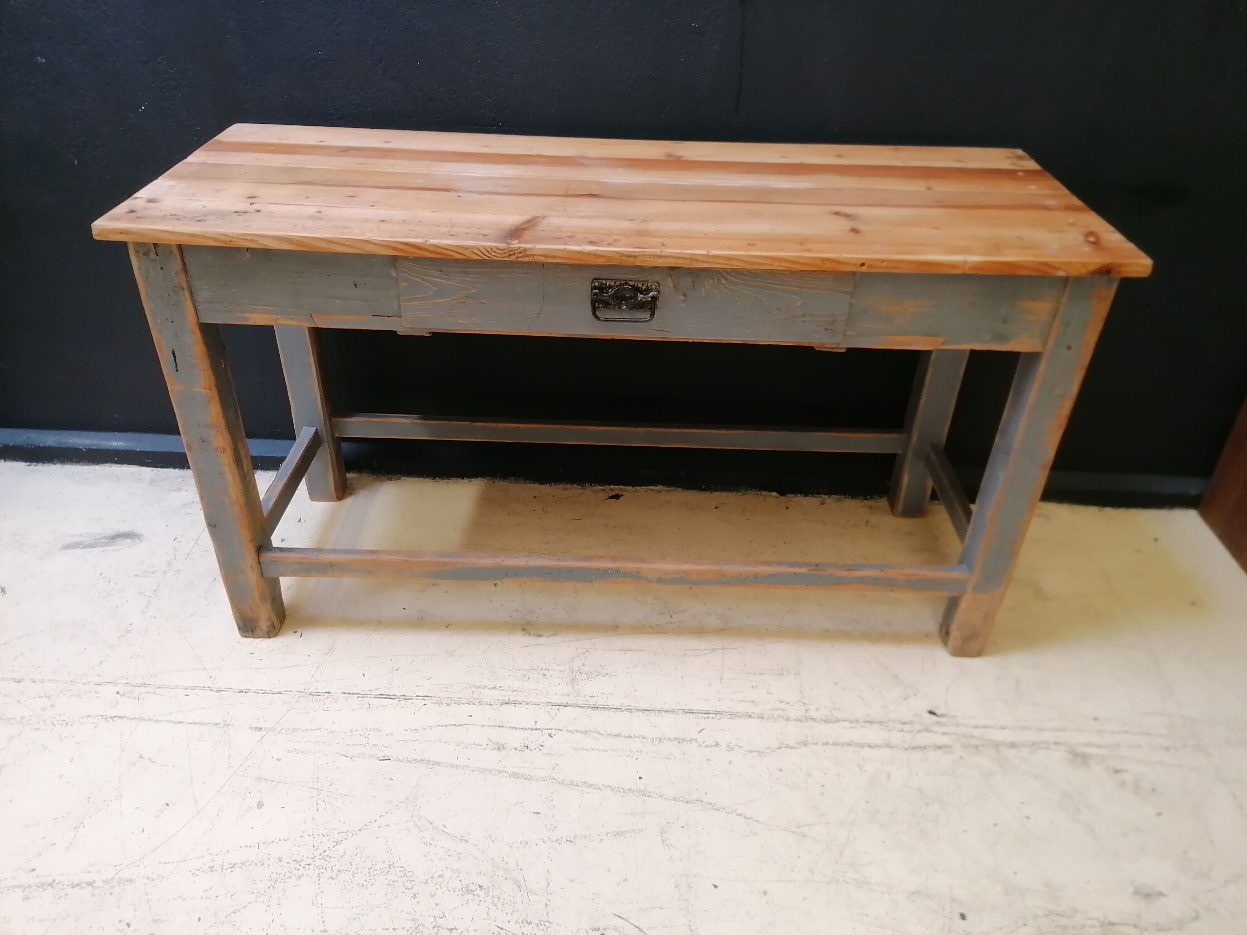 Patinated drapery table