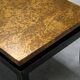 Modernist coffee table with a patinated gold top, 120x52.5x36 cm, mid-20th century.