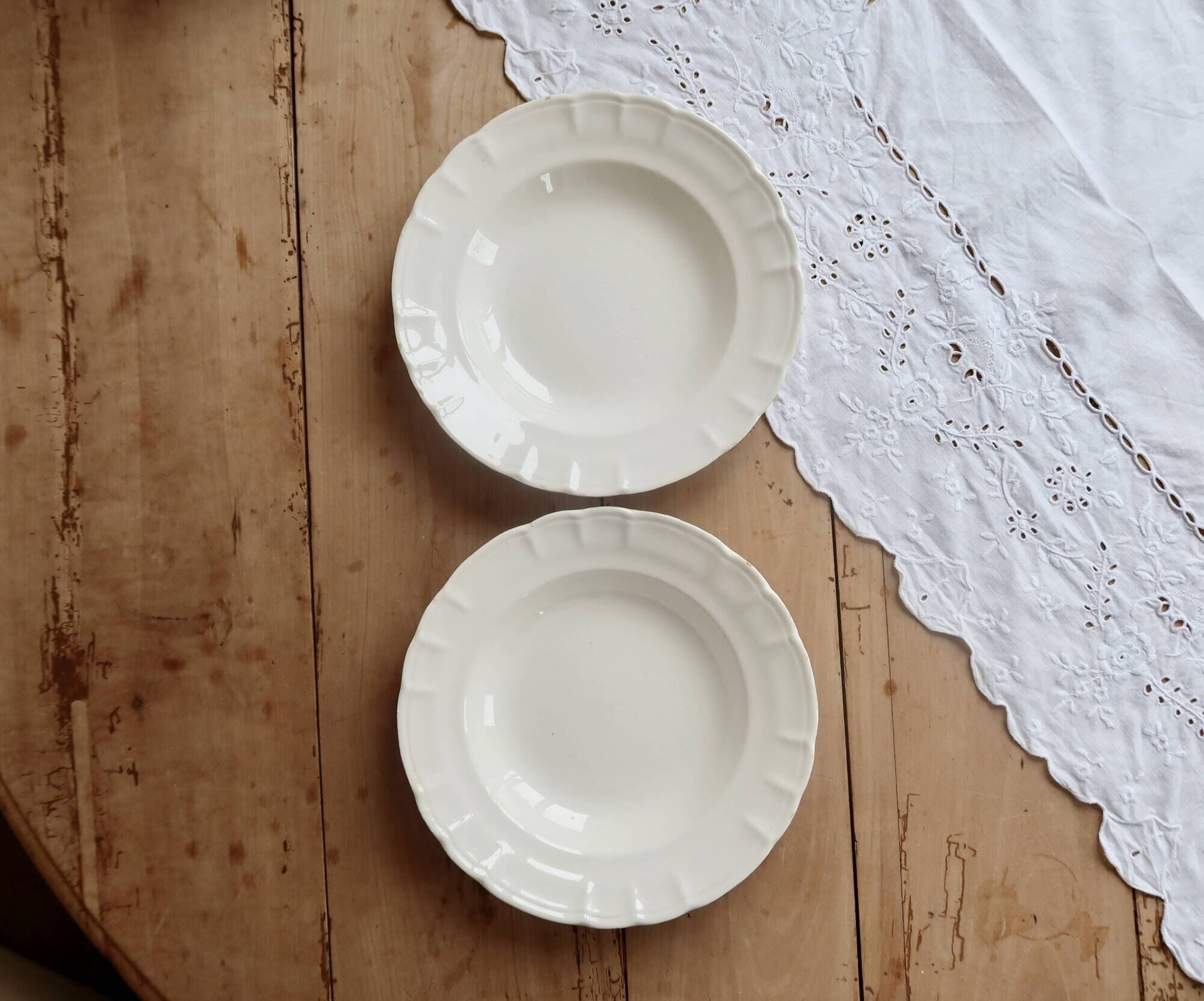 Pair of antique ivory faience deep plates ADP Luxcerae