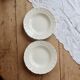 Pair of antique ivory faience deep plates ADP Luxcerae